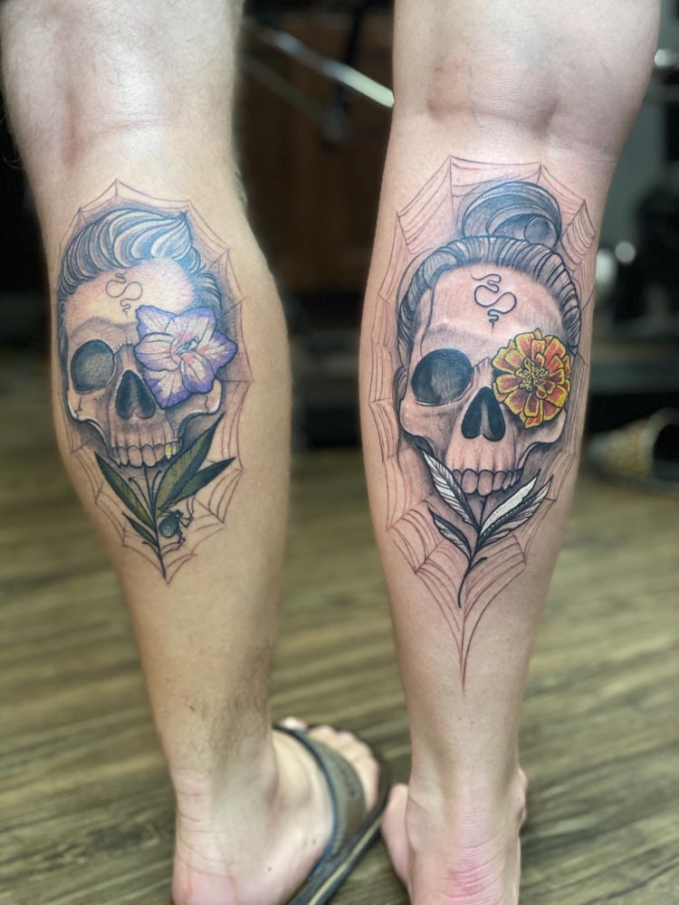 Black And Grey Skull Tattoo On Back Leg
