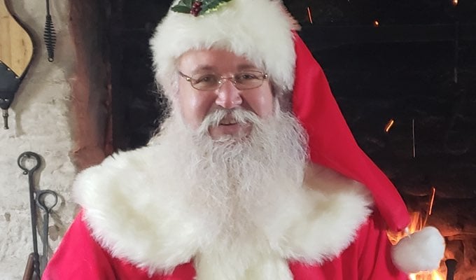 Mike Szudera has been dressing up as St. Nick since he retired from the military and his kids told him they were too old to go see Santa at the mall.