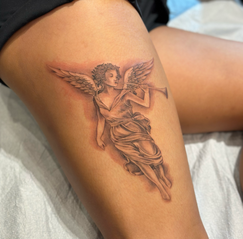 Kelly's angel tattoo