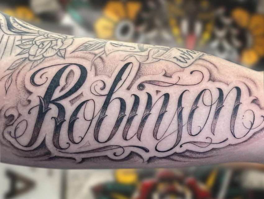 Matthew Powell Script tattoo